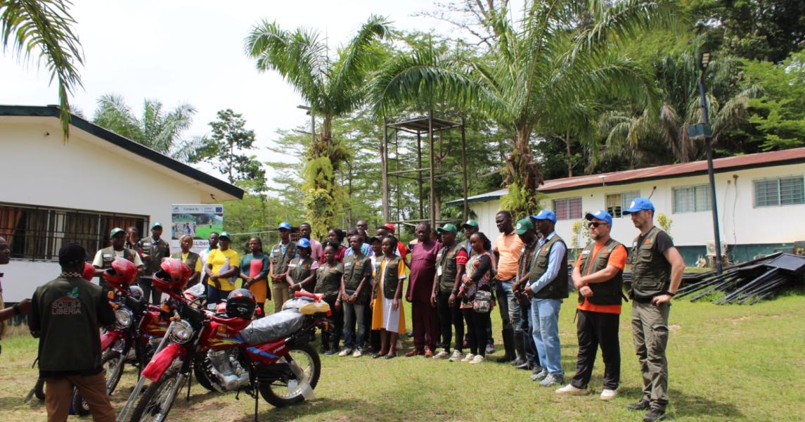 CARI Director General Dr. Arthur Bob Karnuah, flanked by IITA field staff, poses for a group photo with newly displayed equipment for the Soils4Liberia Project.