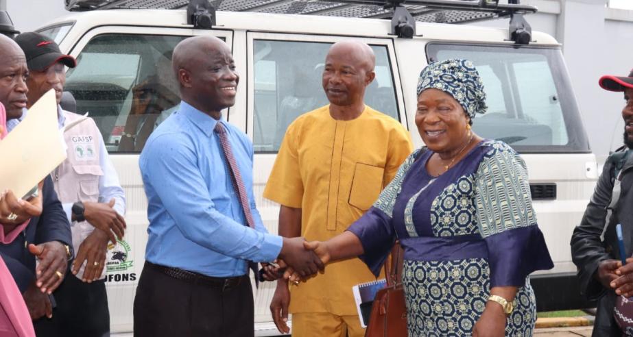 Minister Nuetah handover keys to Mrs. Kromah as Mr. Momo and Joseph Woah look on.