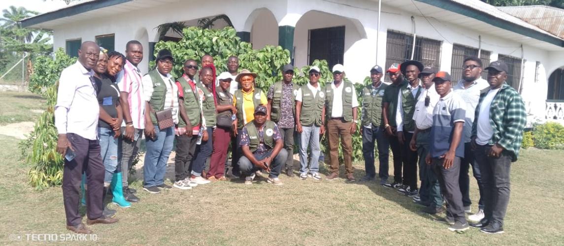 The arrival of Director General Dr. Arthur Bob Karnuah, accompanied by CARI management staff and researchers, standing before the field office at the Beeplay hub in Buuyao District, Nimba County.   