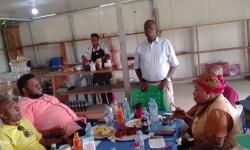 Dr. Arthur Bob Karnuah addresses professional staff during the coffee break