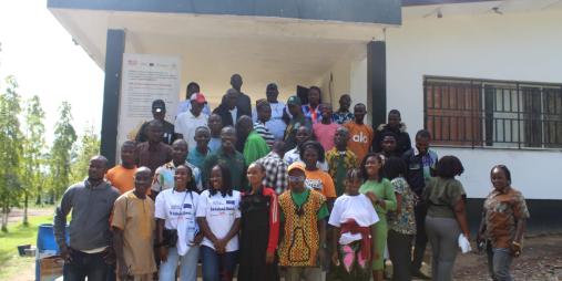 Participants from the cassava, wood, fisheries, and aquaculture sectors, along with youth and persons living with disabilities (PLWDs), pose with facilitators for a group photo during the aquaculture training workshop.